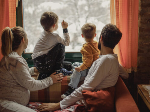 Young St Louis family enjoying the winter scene outside